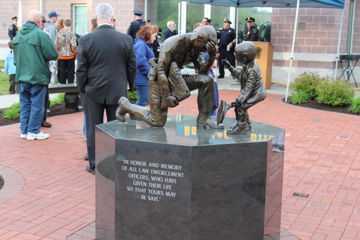 People by the Rockland Police Memorial Statue