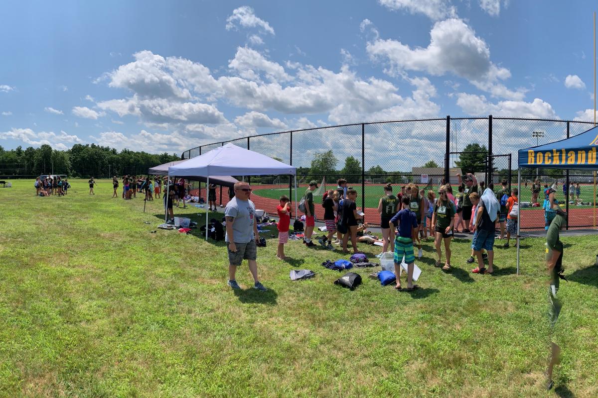 Group of Kids outside by event tents